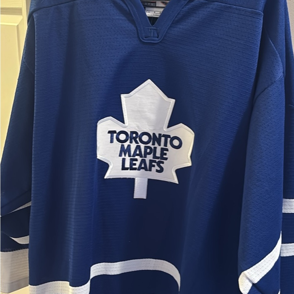 Nike Blue Hockey Jersey with White and Orange Accents